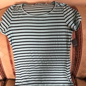 Tahari Short Sleeved shirt. Light weight. Short in the front longer back